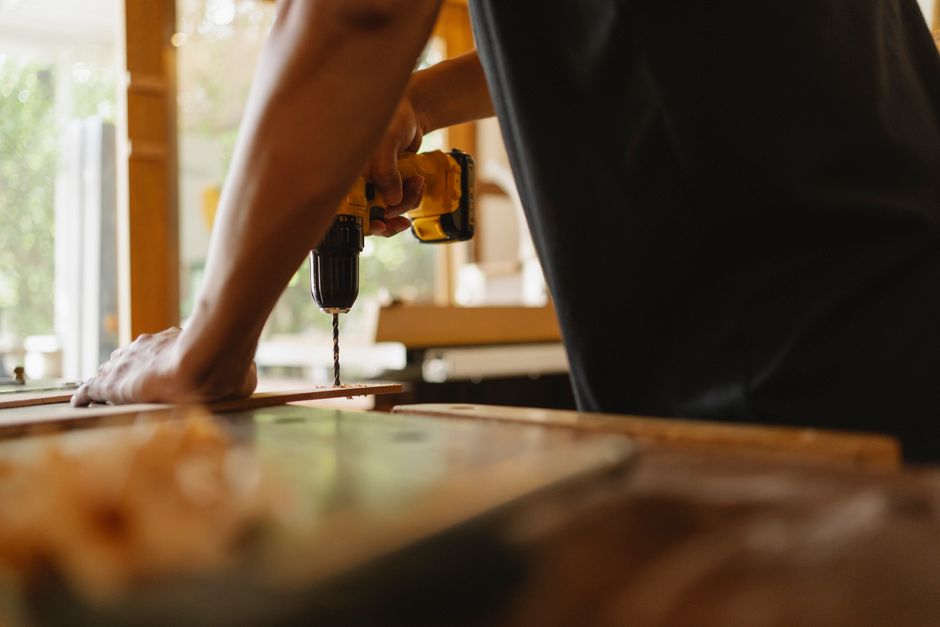 Experienced carpenter installing custom kitchen cabinets